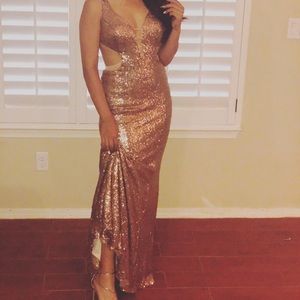 Deep gold Sequin evening gown with plunge neck.